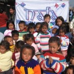nafa-knitters-2 Jumpers knitted by our Aussie Nafa Knitters being distributed to the appreciative children of parents who are low paid workers in a Thimi Carpet factory.