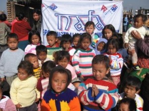 Jumpers knitted by our Aussie Nafa Knitters being distributed to the appreciative children of parents who are low paid  workers in a Thimi Carpet factory.